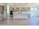 Beautiful kitchen with stainless steel appliances, a spacious island, and sleek gray cabinetry at 22685 E Saddle Way, Queen Creek, AZ 85142