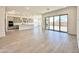 Open floor plan showing the large kitchen, dining, and living areas with sliding doors to the backyard at 22685 E Saddle Way, Queen Creek, AZ 85142