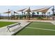 Outdoor playground with play structures, shade canopies, and benches at 22685 E Saddle Way, Queen Creek, AZ 85142