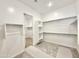 A spacious walk-in closet features ample shelving and hanging space for organized storage at 22685 E Saddle Way, Queen Creek, AZ 85142