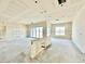 Spacious unfinished living area featuring drywall and a sliding glass door to access the backyard at 22693 E Saddle Way, Queen Creek, AZ 85142