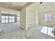 Unfinished living area with drywall and large sliding glass doors leading to the backyard at 22693 E Saddle Way, Queen Creek, AZ 85142