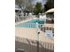 Community fenced swimming pool and shaded seating offer amenities at 2530 W Berridge Ln # E201, Phoenix, AZ 85017