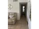 Neutral hallway features tile flooring, neutral wall colors, and mirrored decor at 2530 W Berridge Ln # E201, Phoenix, AZ 85017