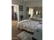 Spacious main bedroom featuring a large bed, mirrored wall, and a walk-in closet at 2530 W Berridge Ln # E201, Phoenix, AZ 85017