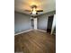 Bedroom with wood-look floors and a closet. Window provides natural light at 2551 W Berridge Ln # D6, Phoenix, AZ 85017