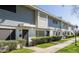 Exterior view of townhouses with landscaped walkways offering a welcoming curb appeal at 2551 W Berridge Ln # D6, Phoenix, AZ 85017