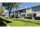 Charming townhouse with well-manicured lawn, mature trees and inviting curb appeal at 2551 W Berridge Ln # D6, Phoenix, AZ 85017