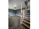 Open living area with a ceiling fan, wood floors, and bright stairs at 2551 W Berridge Ln # D6, Phoenix, AZ 85017