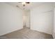 A minimalist bedroom features a ceiling fan and neutral color palette at 2560 E Indian Wells Pl, Chandler, AZ 85249