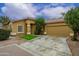 Single story home featuring a two car garage and low maintenance landscaping at 2560 E Indian Wells Pl, Chandler, AZ 85249