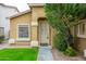 Charming home entrance with a well-manicured lawn and inviting front door at 2560 E Indian Wells Pl, Chandler, AZ 85249