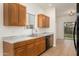 A well-appointed kitchen with wooden cabinetry, marble countertops, and modern appliances at 2560 E Indian Wells Pl, Chandler, AZ 85249