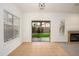 Bright living room with tiled entry, sliding glass doors, fireplace and backyard view at 2560 E Indian Wells Pl, Chandler, AZ 85249