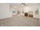 Spacious living area featuring a cozy fireplace and seamless transition to the outdoor patio at 2560 E Indian Wells Pl, Chandler, AZ 85249