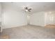 Spacious living room featuring neutral carpet, ample natural light, and open floor plan at 2560 E Indian Wells Pl, Chandler, AZ 85249
