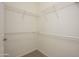 Walk-in closet with shelving and ample storage space for an organized wardrobe at 2560 E Indian Wells Pl, Chandler, AZ 85249