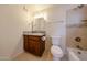 This bathroom features a single sink vanity, toilet, and shower with tiled walls at 3125 E Grovers Ave, Phoenix, AZ 85032
