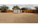 Exterior view of garage showing a desert landscaped backyard at 3125 E Grovers Ave, Phoenix, AZ 85032