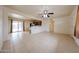 Open-concept space with tile floors and view to backyard at 3125 E Grovers Ave, Phoenix, AZ 85032