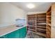Storage room with counter space and built in shelving at 3125 E Grovers Ave, Phoenix, AZ 85032