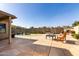 Backyard oasis with a pool, waterfall feature, telescope, and patio area at 33224 N Cat Hills Ave, San Tan Valley, AZ 85144