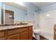 Bathroom with wood vanity, granite countertops, and combination tub/shower at 33224 N Cat Hills Ave, San Tan Valley, AZ 85144