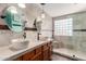 Luxurious bathroom with dual vessel sinks and a custom tiled walk-in shower at 33224 N Cat Hills Ave, San Tan Valley, AZ 85144