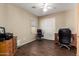 Office space with tiled floors, ceiling fan, closet, desk, and filing cabinets at 33224 N Cat Hills Ave, San Tan Valley, AZ 85144