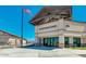 A view of the community center entrance featuring modern architecture and an American flag at 33224 N Cat Hills Ave, San Tan Valley, AZ 85144