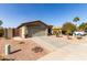 Property showcasing a well-maintained desert landscape, a wide driveway, and a two-car garage at 33224 N Cat Hills Ave, San Tan Valley, AZ 85144