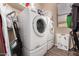 Bright laundry room with washer, dryer and storage at 33224 N Cat Hills Ave, San Tan Valley, AZ 85144