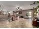 Bright, open living area with neutral colors, tile floors, and sliding glass doors to the outdoor space at 33224 N Cat Hills Ave, San Tan Valley, AZ 85144