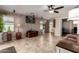 Open living room featuring a large window, neutral paint, and decorative plants that add a touch of nature indoors at 33224 N Cat Hills Ave, San Tan Valley, AZ 85144