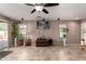 Picture of an open living room with neutral walls, a ceiling fan, and plants, enhancing the area's appeal at 33224 N Cat Hills Ave, San Tan Valley, AZ 85144