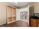 Office space with custom built in shelves, opening to the living room at 33224 N Cat Hills Ave, San Tan Valley, AZ 85144