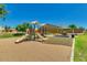Community playground with slides offers a fun and safe space for children to play at 33224 N Cat Hills Ave, San Tan Valley, AZ 85144