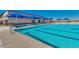 Sparkling community pool with lap lanes and ample seating provides a refreshing escape at 33224 N Cat Hills Ave, San Tan Valley, AZ 85144