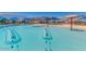 An exceptional community pool area featuring slides and comfortable seating at 33224 N Cat Hills Ave, San Tan Valley, AZ 85144