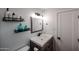 Bathroom featuring a wooden vanity with a white countertop and modern fixtures at 3520 E Ludlow Dr, Phoenix, AZ 85032