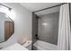 Bathroom featuring a shower/tub combo with tiled walls, a vanity, and modern fixtures at 3520 E Ludlow Dr, Phoenix, AZ 85032