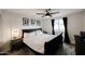 Comfortable bedroom featuring a large bed, neutral decor, and natural light from a window at 3520 E Ludlow Dr, Phoenix, AZ 85032