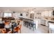 Open-concept kitchen featuring a center island, stainless steel appliances, and white cabinetry at 3520 E Ludlow Dr, Phoenix, AZ 85032