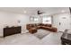 Comfortable living room featuring a sectional couch, tile flooring, and a ceiling fan at 3520 E Ludlow Dr, Phoenix, AZ 85032