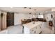 Inviting open-concept living area showcasing a dining area, kitchen and comfortable living room at 3520 E Ludlow Dr, Phoenix, AZ 85032
