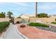 Desert landscaped backyard featuring a fire pit, seating, synthetic grass and privacy walls at 3720 N 150Th Ct, Goodyear, AZ 85395