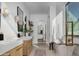 Bright bathroom with double vanity, walk-in shower, soaking tub, and arched doorways at 4120 N 44Th Pl, Phoenix, AZ 85018