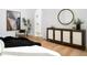 Bedroom featuring hardwood floors, modern decor, and a view of a hallway with an arched doorway at 4120 N 44Th Pl, Phoenix, AZ 85018