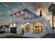 Elegant two-story home boasts a modern design, balcony, outdoor fireplace, and desert landscaping at 4120 N 44Th Pl, Phoenix, AZ 85018