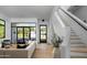 Bright, contemporary home interior with hardwood floors, staircase, and view to the backyard at 4120 N 44Th Pl, Phoenix, AZ 85018